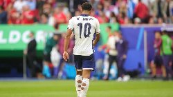 Why do football players cut holes in their socks?